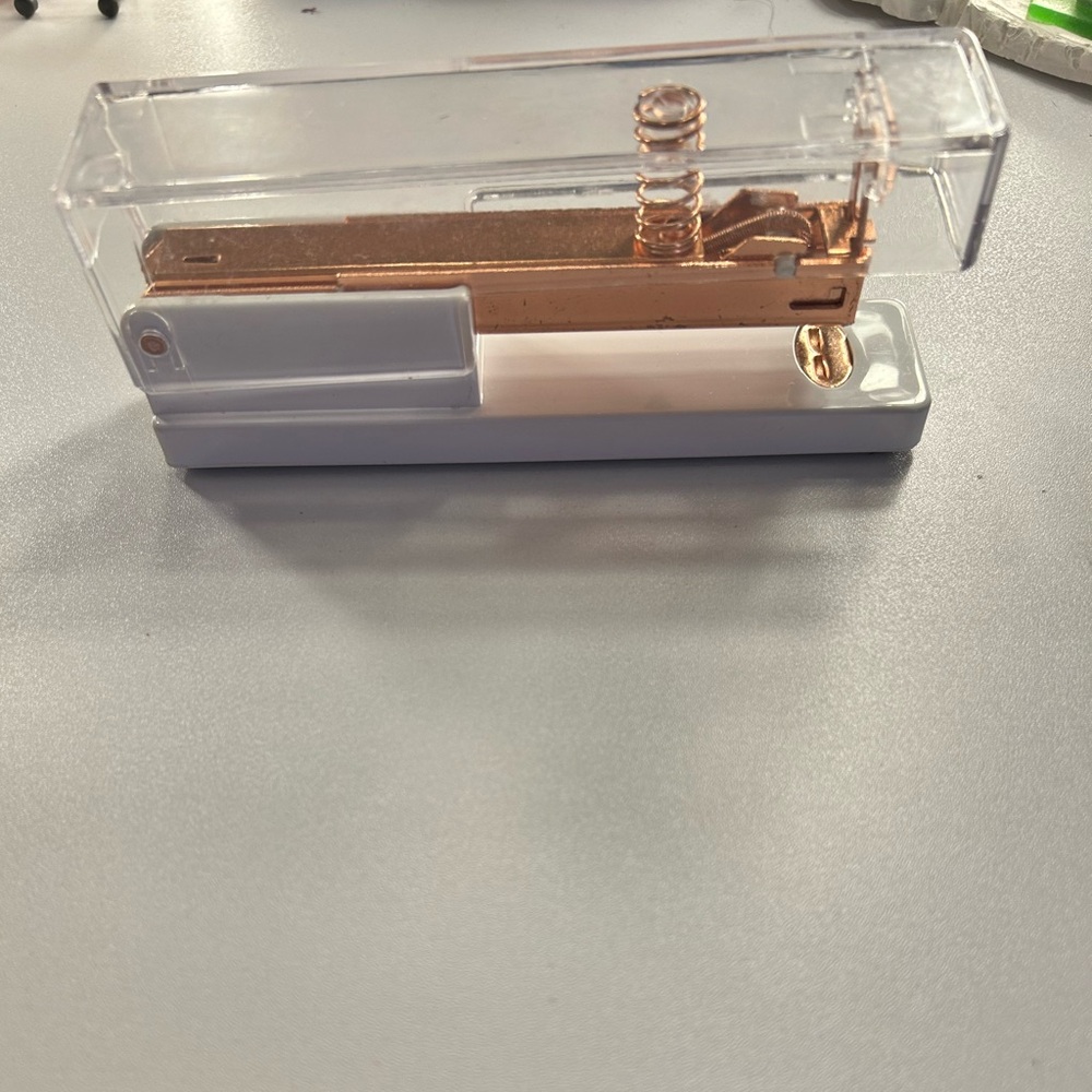 Aesthetic white, clear and rose gold stapler.